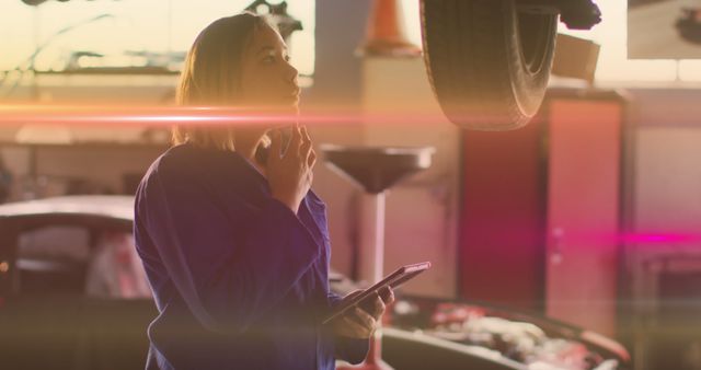 Mechanic Analyzing Car Lifted in Auto Repair Shop - Download Free Stock Images Pikwizard.com