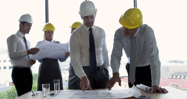 Architects and Engineers Discussing Blueprint in Conference Room - Download Free Stock Images Pikwizard.com