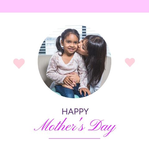 Mother kissing daughter in mother's day celebration