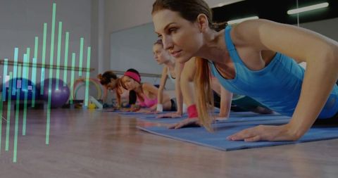 Instructor Leading Group Fitness Class with Focus on Push-Ups