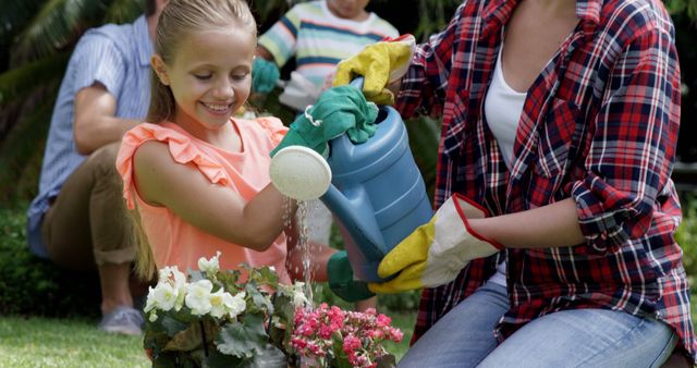 Family Gardening Together Watering Flowers Outdoors - Download Free Stock Images Pikwizard.com