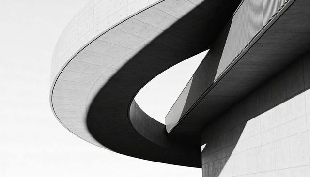 Curving Concrete Ramp Creating Dramatic High Contrast Shadows and Geometric Void Civic Design