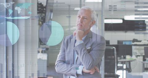 Businessman Contemplating Data Interface in Futuristic Office - Download Free Stock Images Pikwizard.com