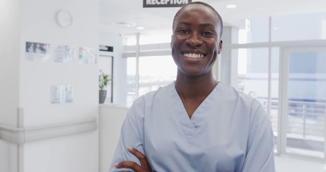 Smiling Nurse Standing in Hospital Reception Area - Download Free Stock Images Pikwizard.com