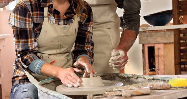 Couple Taking Pottery Class and Molding Clay on Pottery Wheel - Download Free Stock Images Pikwizard.com