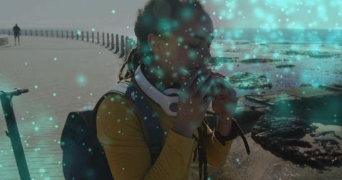 Traveler Enjoying Snack on Seaside Boardwalk Adventure