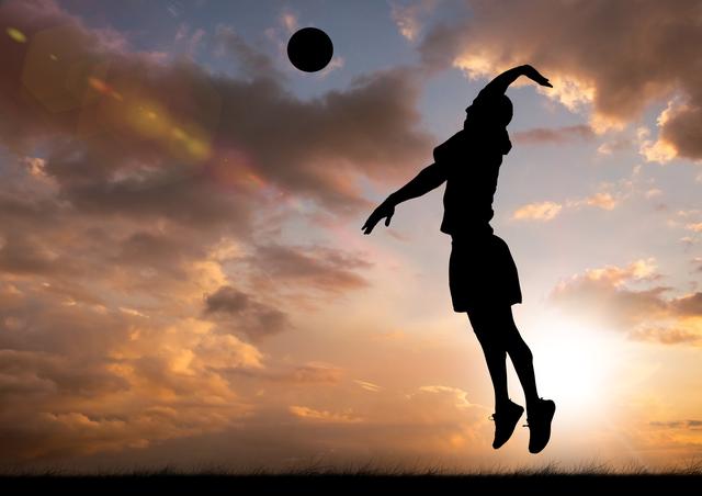 Silhouette of volleyball player jumping and preparing to hit the ball with a vibrant sunset sky in the background. Perfect for sports-themed advertisements, inspirational posters, training materials, and articles highlighting athletic endeavor and outdoor activities.