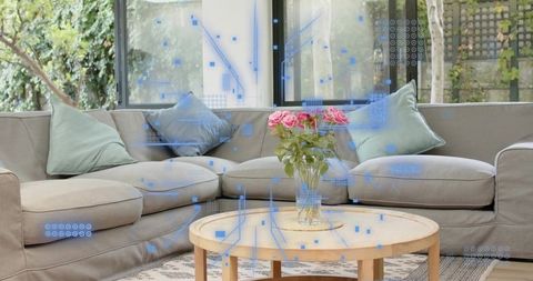Cozy modern living room featuring gray l-shaped sofa and pink rose bouquet