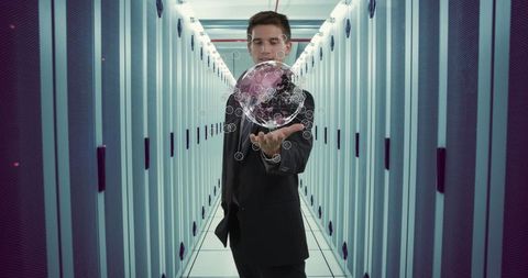 Businessman in Data Center Interacting with Digital Globe Visualization