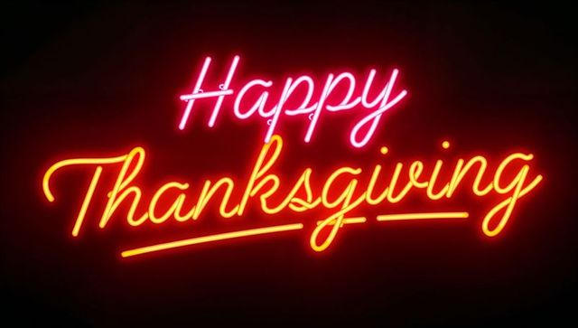 Happy Thanksgiving Neon Script Sign Glowing Orange and Pink Halo on Dark Wall Display