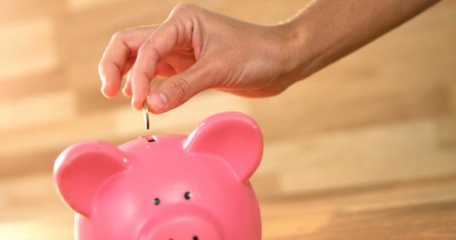 Hand Putting Coin in Piggy Bank for Saving Money Concept - Download Free Stock Images Pikwizard.com