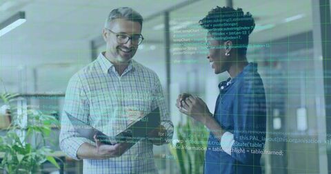 Collaborative Tech Team in Modern Workplace with Data Overlay