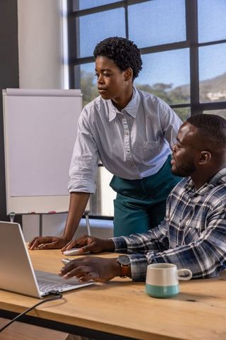 African american professionals collaborating in modern conference room