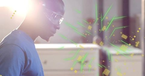 Technician wearing safety goggles examining holographic interface with neon green data