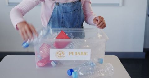 Child Practicing Recycling by Sorting Plastic Bottles - Download Free Stock Images Pikwizard.com