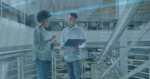 Colleagues Collaborating with Technology in Modern Corporate Environment