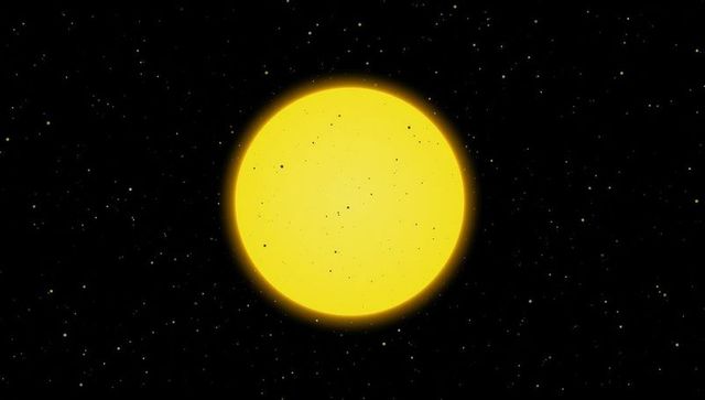 Luminous yellow star surrounded by stars in deep space