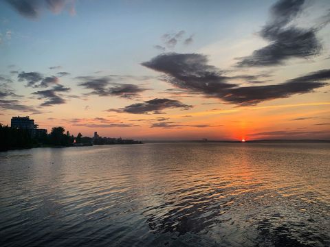 Tranquil sunset over serene beach landscape
