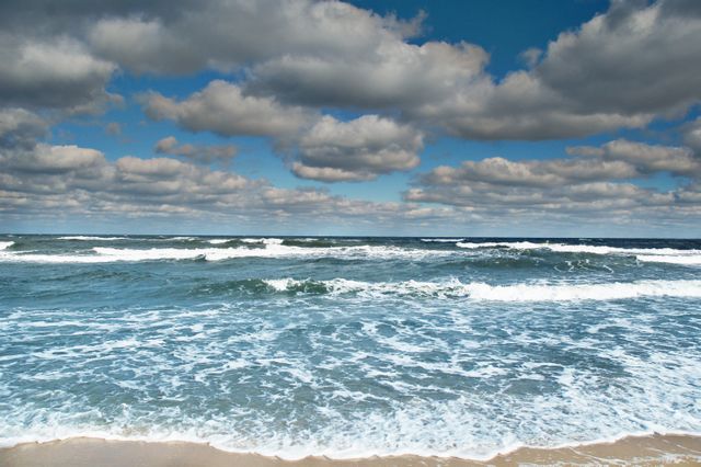 Calm Ocean Waves Under Cloudy Sky - Download Free Stock Photos Pikwizard.com