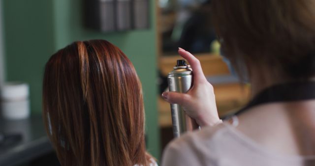 Hairdresser Applying Hairspray to Client's Hair in Salon - Download Free Stock Images Pikwizard.com