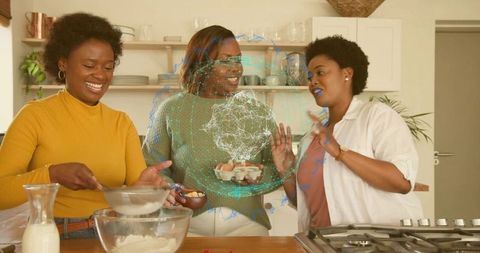 Three women baking together in cozy kitchen sharing laughter, eggs, flour and friendship
