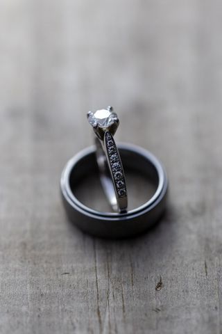 Elegant Wedding Rings on Wooden Surface