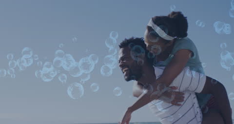 Joyful Family Fun with Interactive Digital Bubbles at Beach