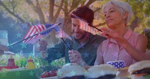 Family celebrating with american flags and festive dining