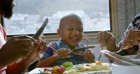 Joyful family dining experience with laughter