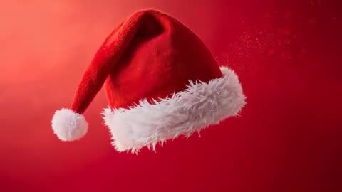 Drifting Santa Hat Rotating Over Red Gradient Backdrop With Glittering Snow Dust