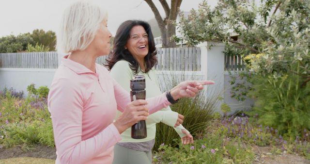 Senior Women Walking and Laughing in Garden - Download Free Stock Images Pikwizard.com