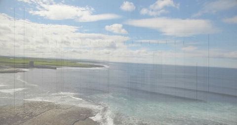 Scenic Coastal Landscape with Rocky Shoreline and Tower Ruin