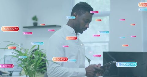 Businessman Using Tablet with Social Media Overlays in Modern Office - Download Free Stock Images Pikwizard.com