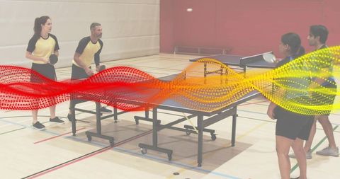 Four players playing table tennis doubles in gym with colorful motion wave overlay