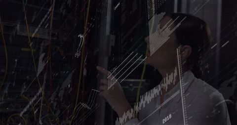 It technician analyzing server racks for network security optimization