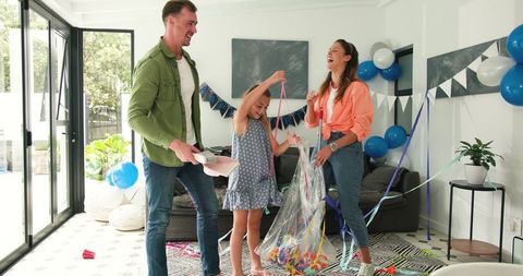 Family Cleaning Together After Celebrating Birthday at Home