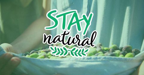 Stay Natural Message Over Farmer Harvesting Organic Fruit