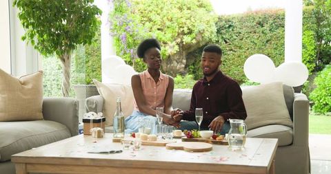 Young Couple Arranging Table for Outdoor Lunch Gathering