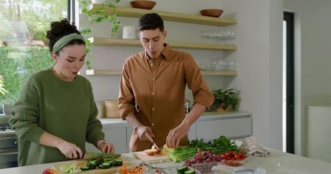 Couple Preparing Healthy Salad Together in Modern Kitchen