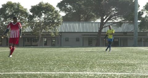 Soccer Players Practicing on Field Displaying Teamwork and Skill