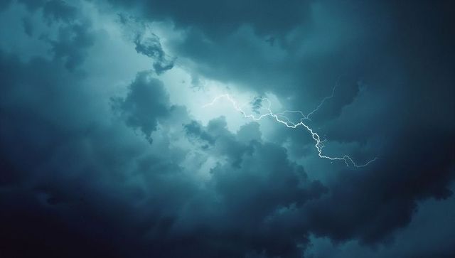 Jagged Lightning Against Dramatic Turbulent Night Sky