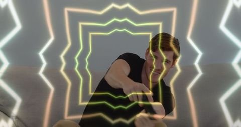 Caucasian Man Immersed in Virtual Reality with Neon Light Effects