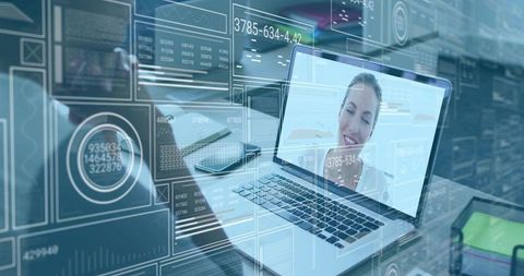 Remote video meeting with smiling woman on laptop overlaid with digital HUD dashboards