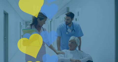 Healthcare Professionals Assisting Senior Patient in Wheelchair