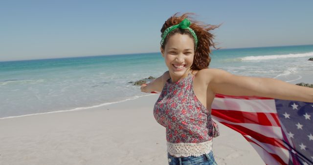 Joyful Woman Holding American Flag at Beach - Download Free Stock Images Pikwizard.com