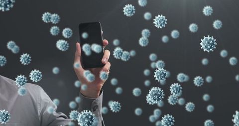 Smartphone in virus-laden environment highlighting pandemic risk