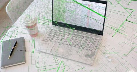 Modern Technology Desk with Laptop and Circuit Overlay