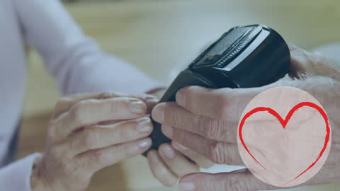 Senior Using Contactless Payment Technology with Smartphone