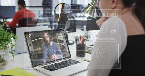 Businesswoman Video Conferencing on Laptop in Modern Office