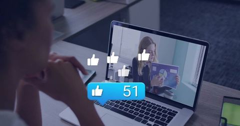 Remote presenter sharing data while viewer receiving social likes on laptop in virtual meeting